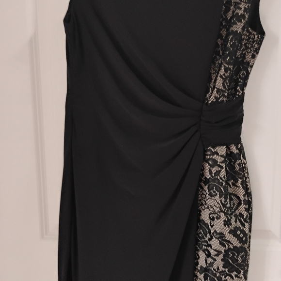 Classic black dress with delicate lace accents along the sides. - Picture 3 of 3